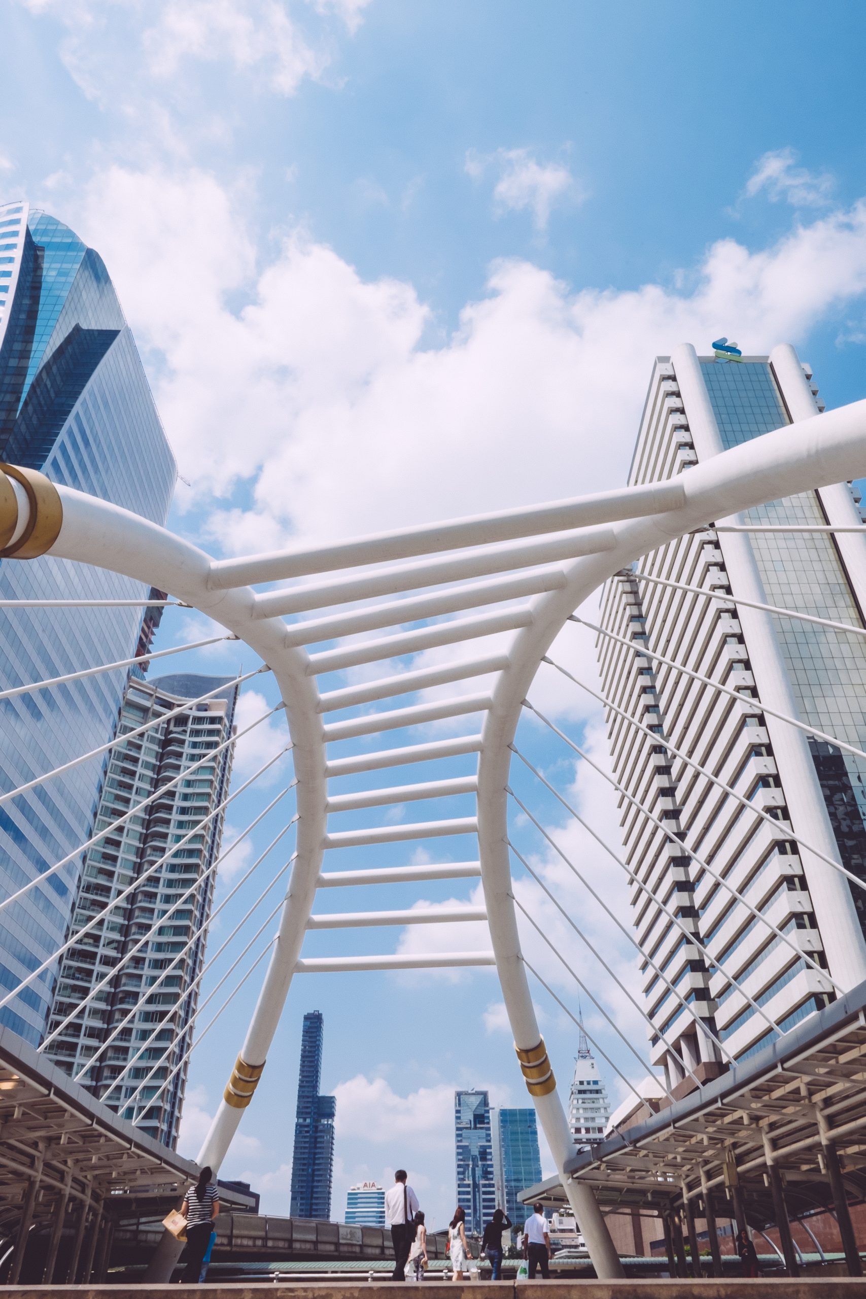A low angle shot of beautiful modern futuristic architecture of an urban city on a sunny day